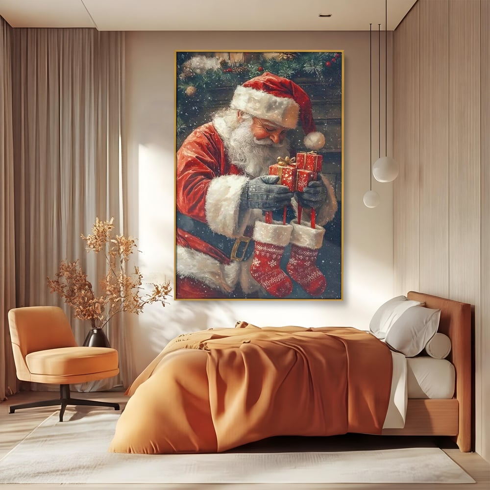 Tablou canvas cu ilustratie cu mos craciun tinand cadouri, in rama de aluminiu auriu, pe perete intr-un dormitor